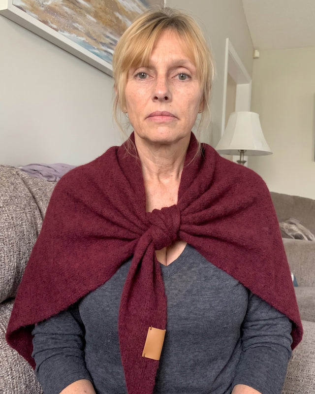 Red Fleece Shawl knotted over a beige sweater