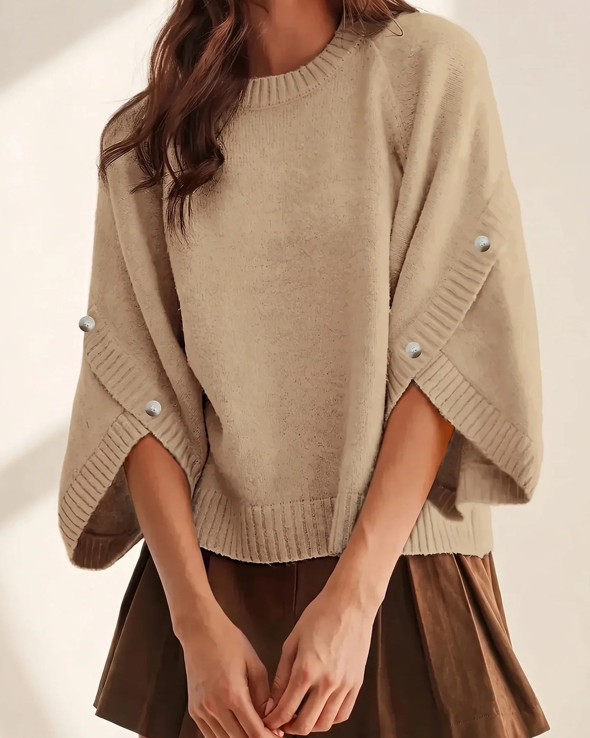 The Elodie Tulip Sleeve Sweater in Latte, split tulip sleeves open at the forearm