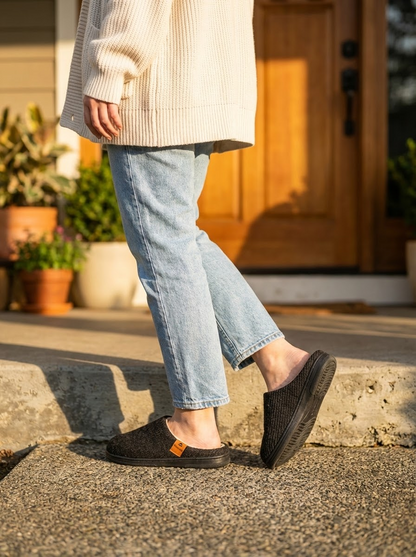 Model wearing CloudStep Fleece-Lined Slippers - outdoor morning