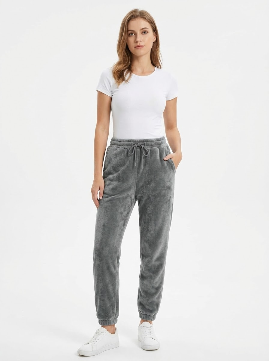 Model wearing ThermaTrack Sherpa-Lined Fleece Joggers - studio front view