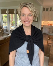 Black Fleece Shawl knotted at the chest, worn