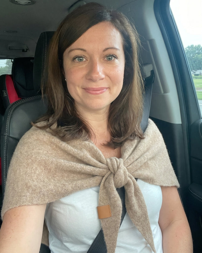 The Fleece Shawl worn in the car with the seat belt on