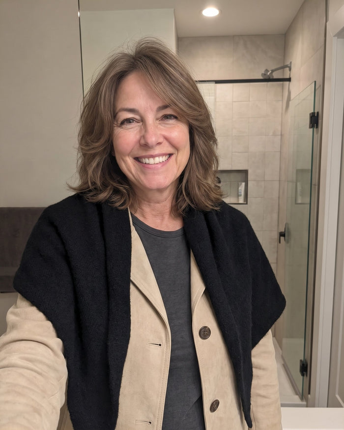 The Fleece Shawl worn open over a jacket