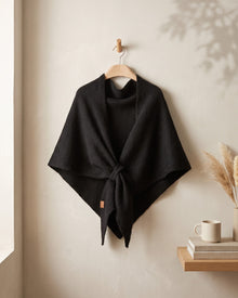 Black Fleece Shawl knotted, on a hanger
