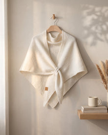 White Fleece Shawl knotted, on a hanger