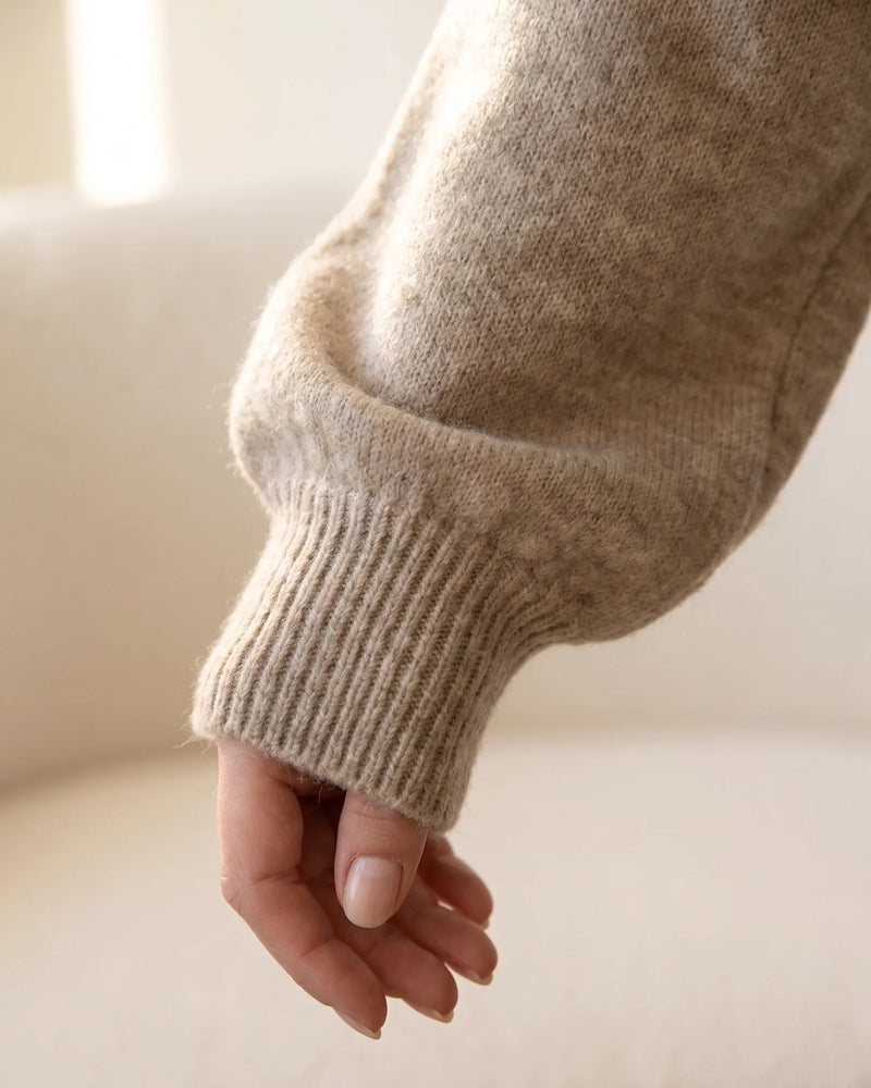 Close view of a full balloon sleeve gathering into its ribbed cuff